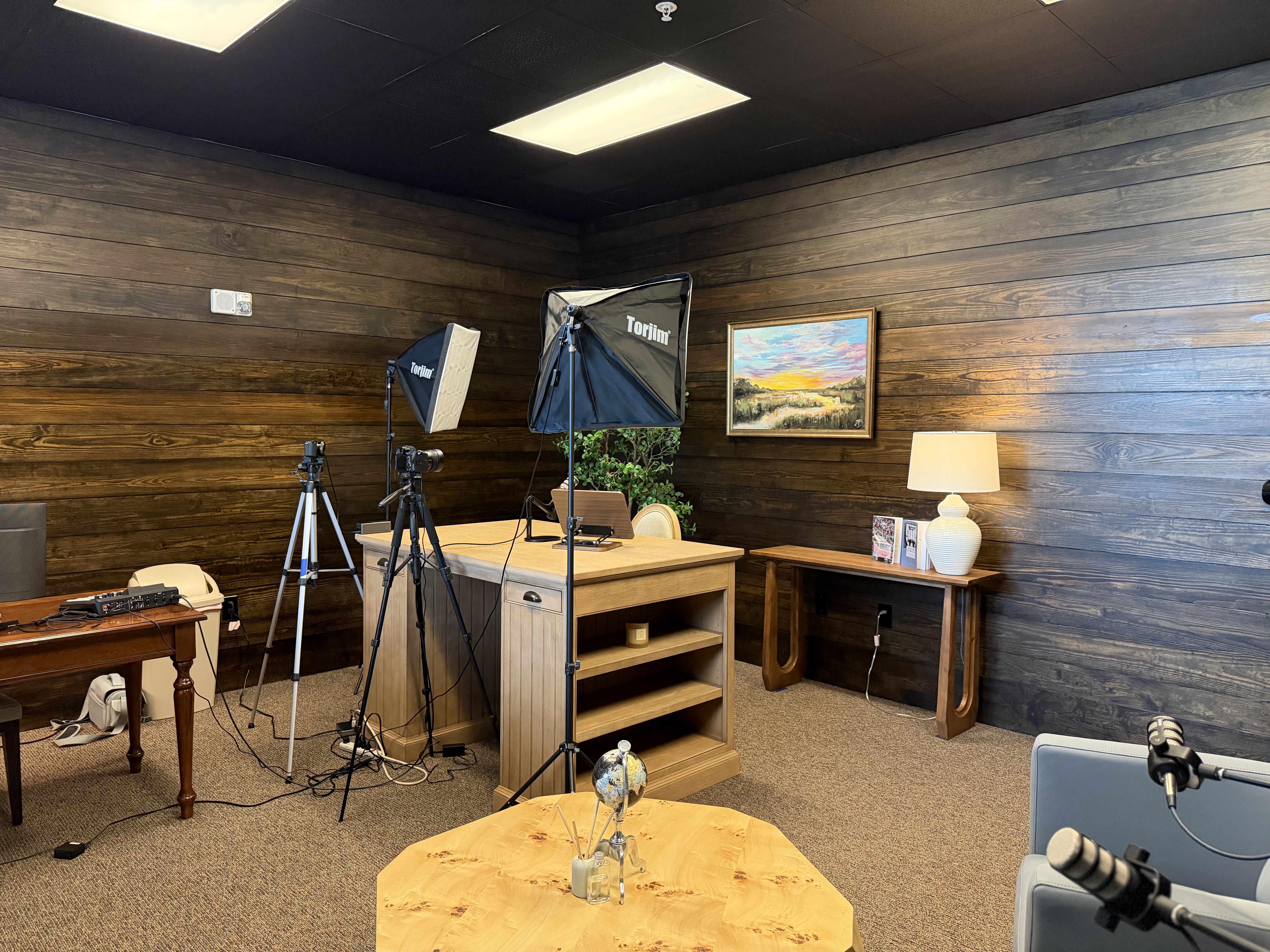 Alternate view of podcast room lighting and recording desk
