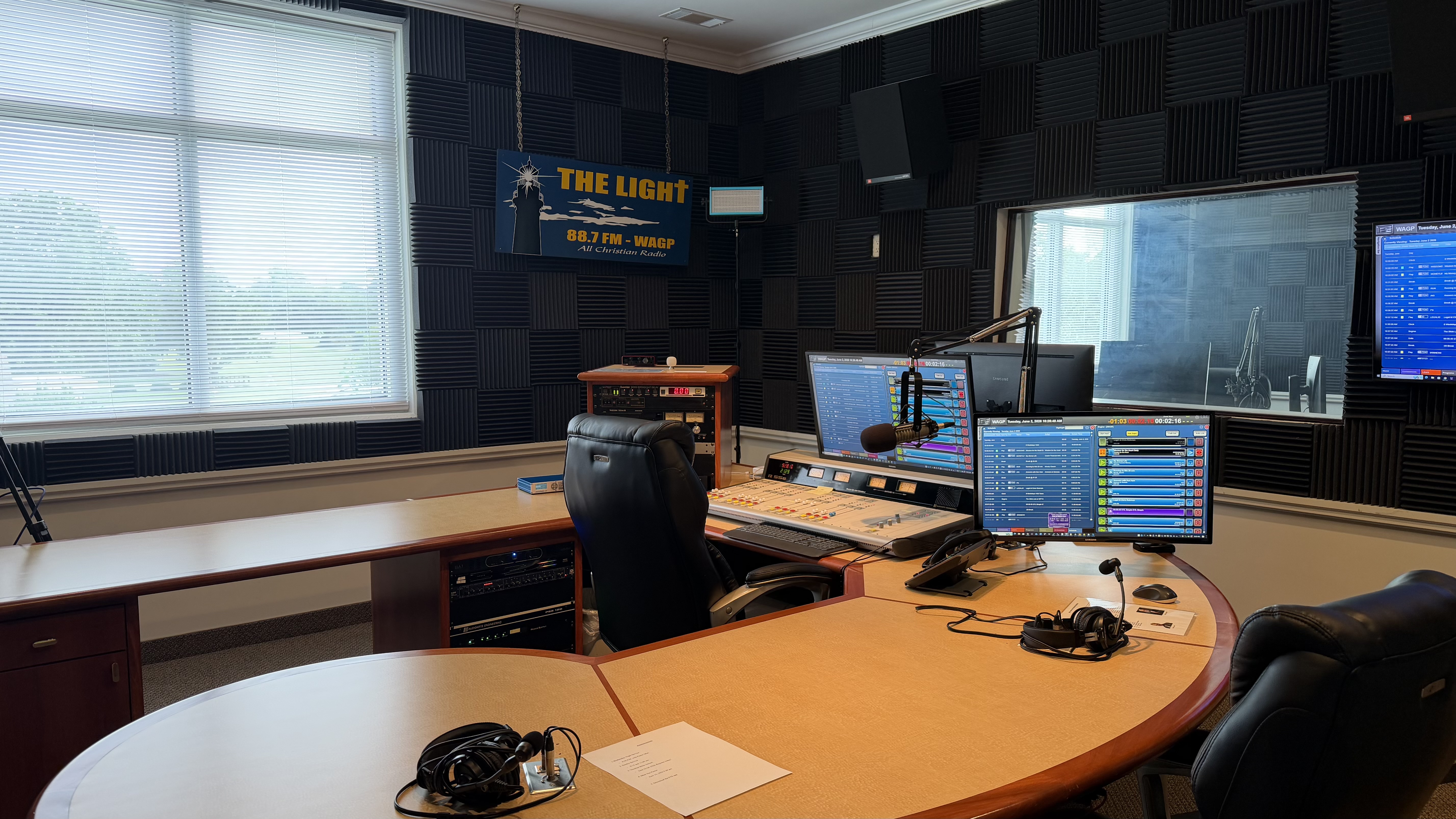 WAGP 88.7 FM broadcast control room with mixing desk and radio equipment